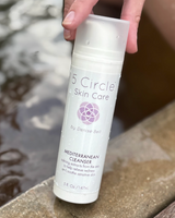 5 Circle Skin Care Mediterranean Cleanser outdoors next to water